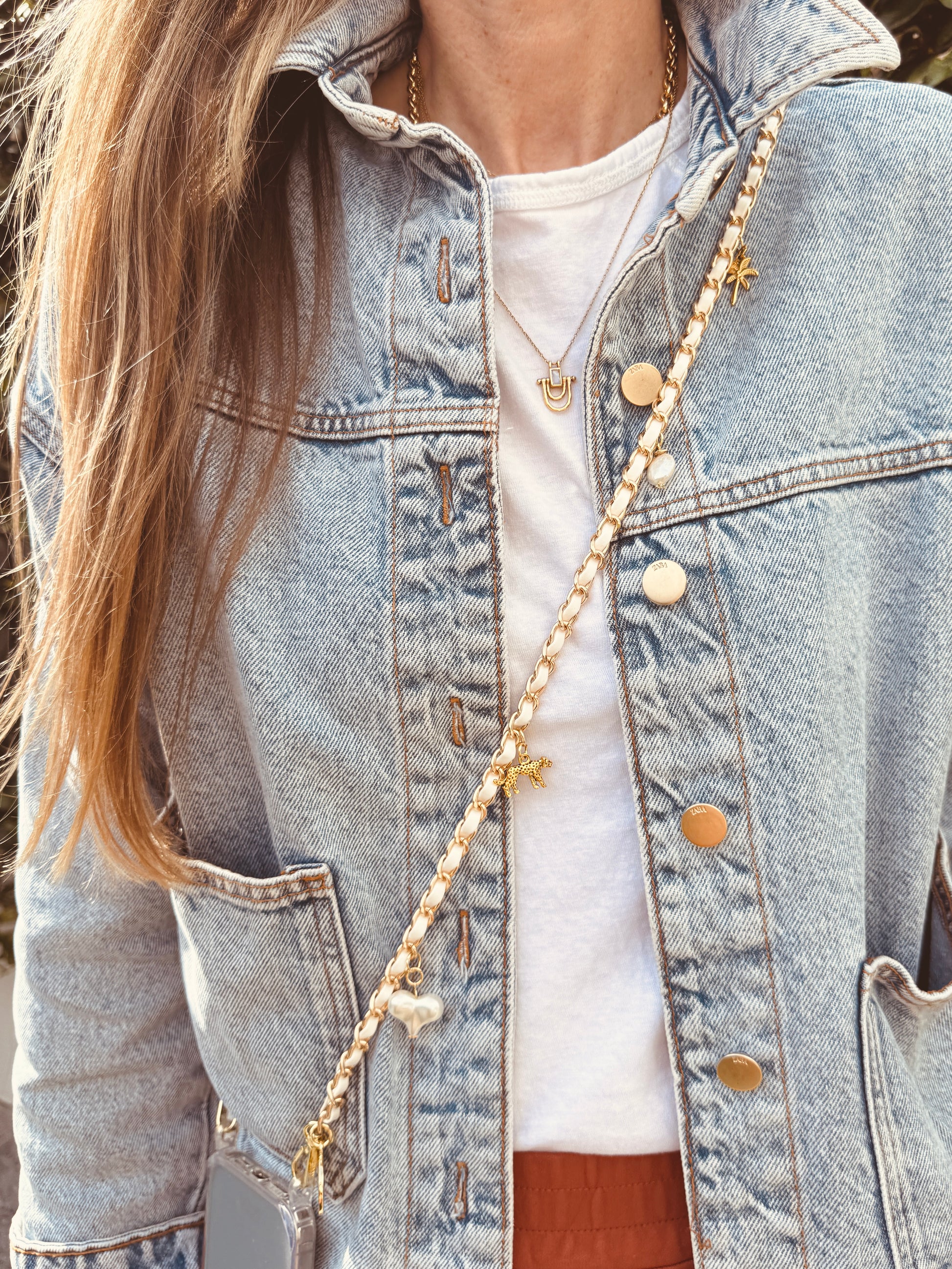 Le_Cap_Crossbody_Phone_Chain_Cream and gold with charms