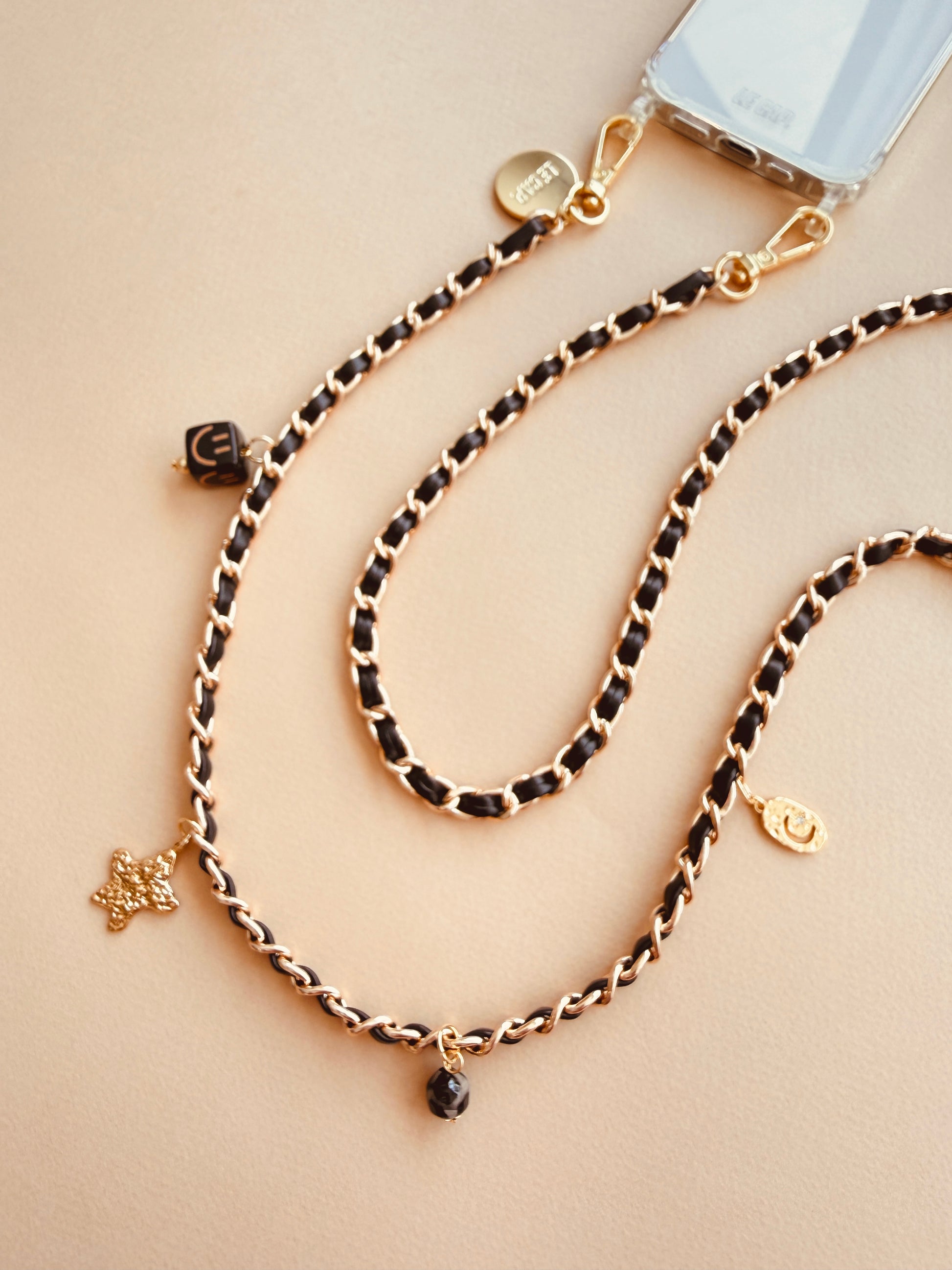 Le_Cap_Crossbody_Phone_Chain_black with gold chain and charms